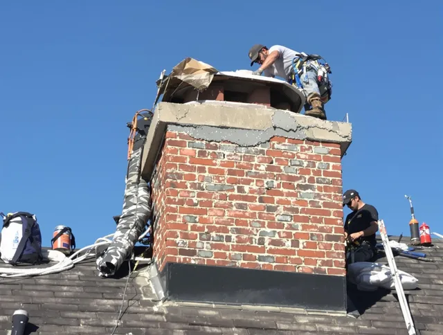 Avon Chimney Sweep installing a custom chimney crown in Avon, OH
