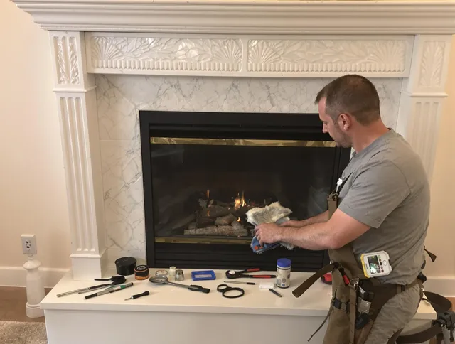 Avon Chimney Sweep performing fireplace maintenance in Avon, OH