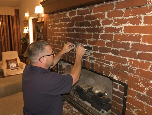 Avon Chimney Sweep expert fixing a fireplace in Avon, OH